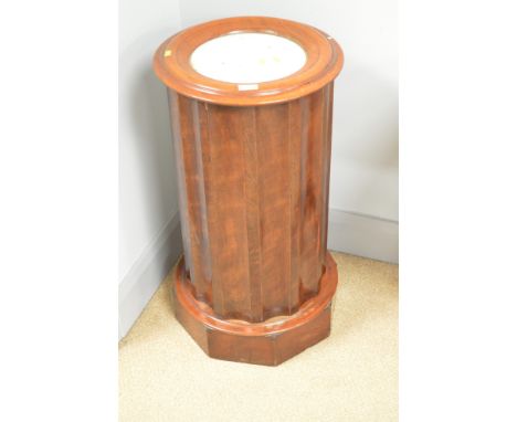 A Victorian cylindrical mahogany pot cupboard with inset marble top, cupboard door to the side opening to reveal a shelf on t