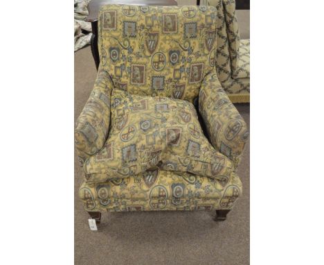 A late 19th Century/early 20th Century armchair, re-upholstered in modern tapestry style fabric with loose seat cushion, rais
