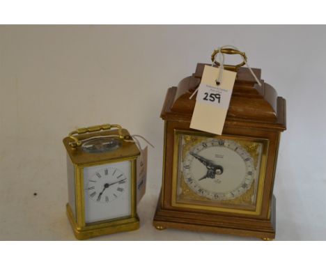 A brass carriage clock, late 19th/Early 20th Century, with enamelled roman dial and platform lever escapement; and a mantel c