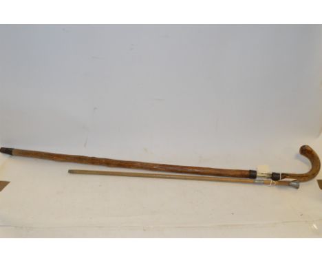 A late 19th Century sword stick, with knotted wood sheath and grip, metal mounts; and a swagger stick.