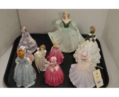 Royal Doulton figurines 'Dinky Do' 1678 and 'Christmas Parcels' 3493; five Royal Worcester figurines including 'Sweet Anne' b