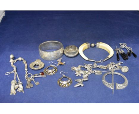 Silver jewellery, including: warthog bracelet; bangle; a silver kilt pin by Robert Allison; a locket; charm bracelet; watch c