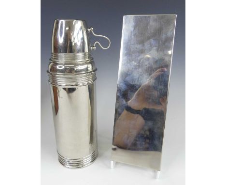 A 1920s tan leather cased travelling 'Thermos' flask retailed by J. C. Vickery of Regent Street, London, the fitted case hous