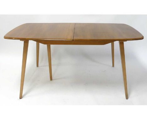 An Ercol blond  elm 'Grand Plank' Windsor extending dining table, having round D-ends, pull-out action and single hinged fold