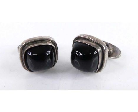 Georg Jensen - a pair of sterling silver cufflinks, each having polished cabochon stone insets, stamped marks and numbered '4