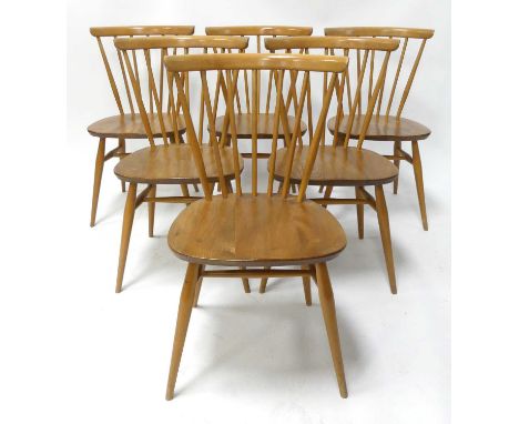 A set of six Ercol blond elm 'Model 449' stickback dining chairs, each with slightly dished seats and raised on turned and ge