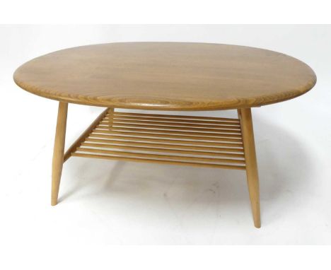 An Ercol blond elm 'Model 454' oval coffee table, raised on turned supports to spindle turned laddered undertier, h.44cm, len