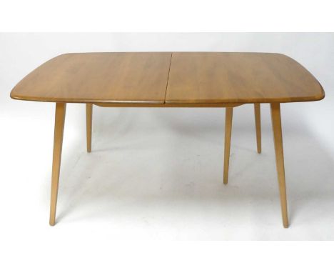 An Ercol blond elm 'Grand Plank' Windsor extending dining table, having rounded D-ends, pullout action and single hinged fold