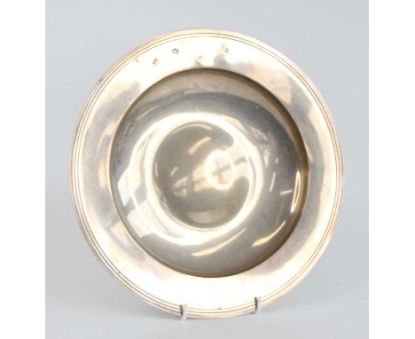 A 1970s silver Armada dish, of typical circular graduated form with indented centre and reeded rim, inscribed to the undersid