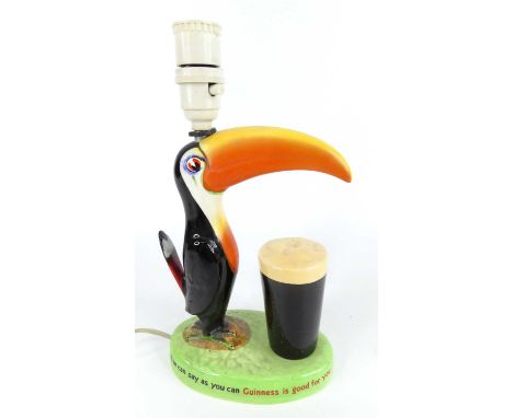 A 1930s Carltonware Guinness Toucan advertising lamp, underglaze painted, titled 'How Grand to be a Toucan, Just think what T