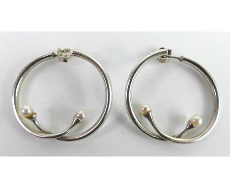 Vivianna Torun Bülow-Hübe (1927-2004) for Georg Jensen - a pair of sterling silver crossover hoop earrings, each with culture