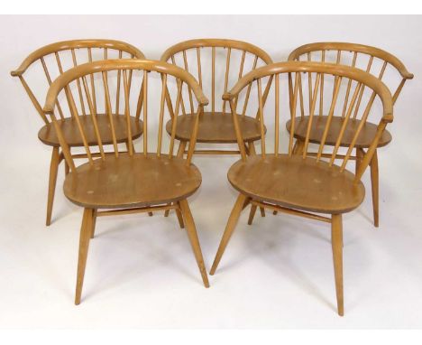 A set of five 1960s Ercol blond elm 'Model 449A' stickback tub elbow chairs, raised on turned slightly tapering supports unit