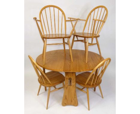 A contemporary Ercol blond elm breakfast suite, comprising; dropleaf table with opposing gateleg action, h.74cm, length 122cm