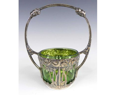A German Art Nouveau silver sugar bowl, having embossed floral stylised and pierced decoration with loop handle, removable gr