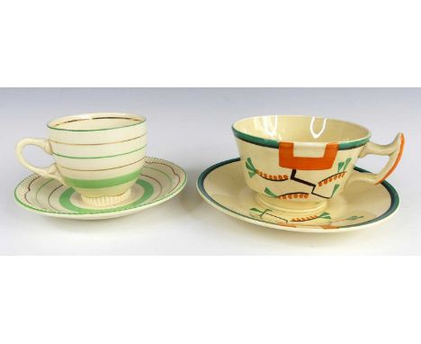 A 1930s Clarice Cliff 'Ravel Orange' pattern pottery teacup and saucer, typically bright colour block painted, printed marks 