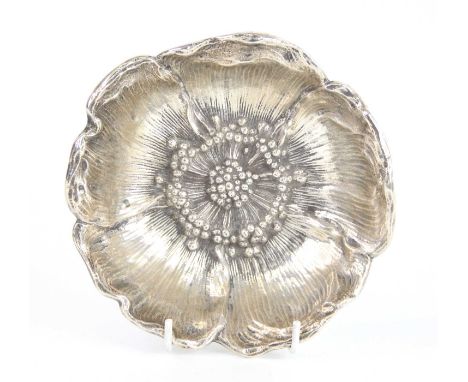 An early 20th century American silver 'Poppy' bowl, of stylised circular form repousse decorated in the form of a poppy flowe