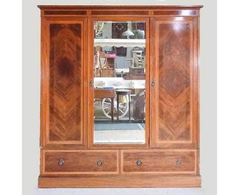 An Edwardian mahogany and inlaid triple wardrobe, on a plinth base190w x 57d x 207h cmOverall condition is complete and usabl