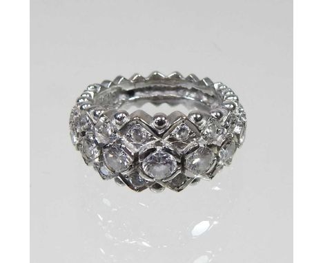 An 18 carat gold diamond cluster ring, set with nine graduated stones, between two rows of stones, 1.6 carat gross, 11.4g gro