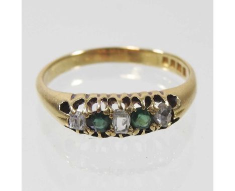 An 18 carat gold emerald and diamond five stone ring, 3g, size P
