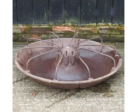 A cast iron circular pig trough, 84cm diameter