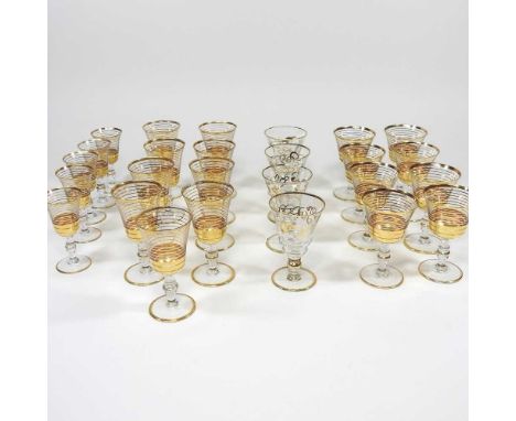 A collection of small Art Deco drinking glasses, with gilt decoration, 9cm highDirty with light signs of use