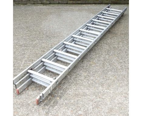 An aluminium ladder, in three sections, each 3m long