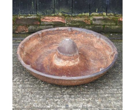 A cast iron circular pig trough, 70cm diameter
