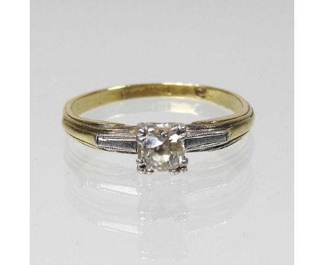 An 18 carat gold and platinum set single stone diamond ring, 2.4g, size M