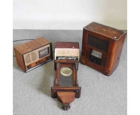 A 1940's vintage radio, together with two others and a wall clock (4)These do not have wires or plugs and are in scruffy cond
