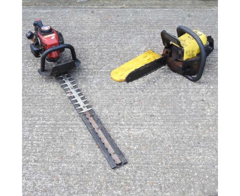 A petrol chainsaw, together with a petrol hedge cutter (2)