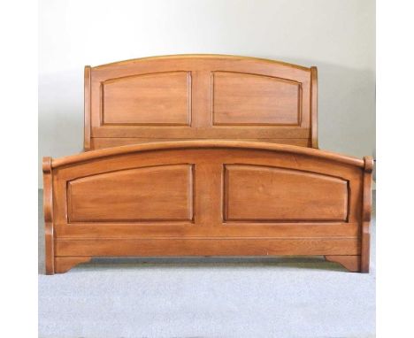 A modern light oak double bed, with a slatted wooden base225w x 165d x 103h cm
