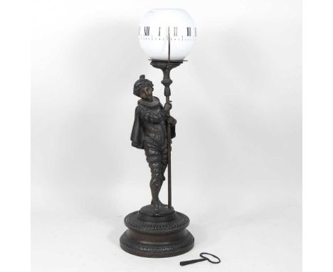A late 19th/early 20th century French spelter mechanical figural mystery night light, in the form a boy holding a glass globe