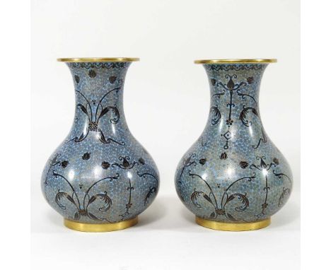 A pair of Chinese cloisonne vases, decorated with scrolling foliate motifs, 18cm high (2)Overall condition is complete, but d