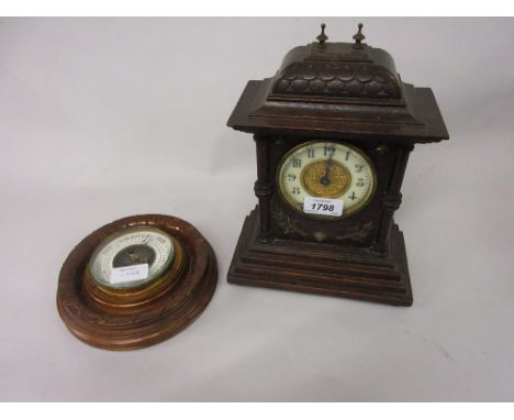 Small Continental oak mantel clock together with a circular aneroid barometer