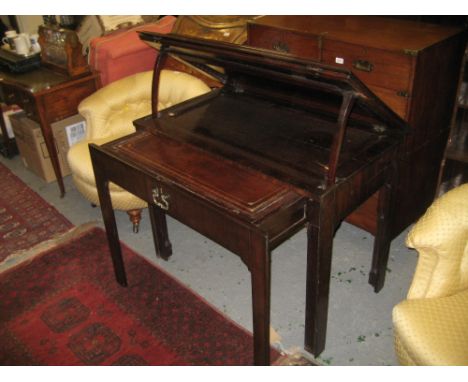 18th Century mahogany architects table, the double hinged rising moulded top above a plain frieze with pull-out base section 