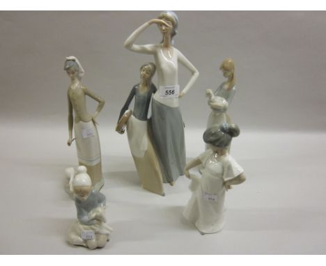 Two boxed Lladro porcelain figures together with three boxed Nao figures