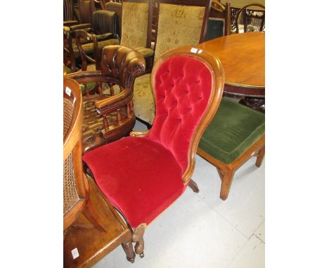 19th Century red button upholstered low seat nursing chair on cabriole supports with casters