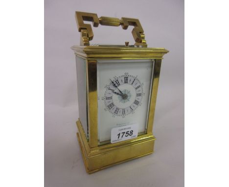 Late 19th or early 20th Century gilt brass cased carriage clock, the painted enamel dial with Arabic and Roman numerals, sign