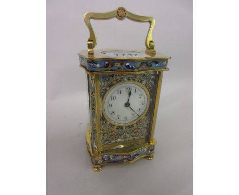 19th Century French gilt brass and champleve enamel carriage clock, the serpentine case enclosing an enamel dial with Arabic 