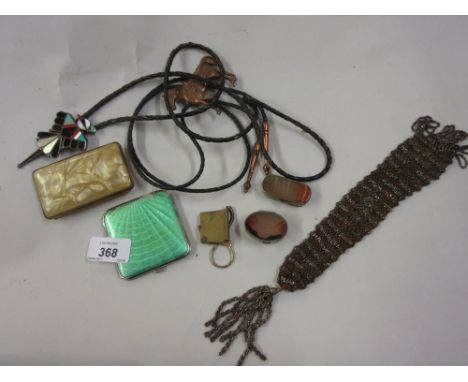 Two agate mounted pill boxes and an enamel decorated plated compact, a Bakelite cigarette case, a misers purse, two American 