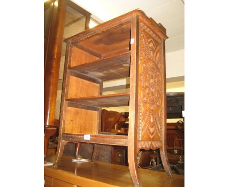 20th Century mahogany four shelf open bookcase with chip carved decoration on splay supports