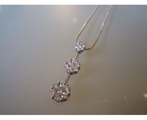 18ct White gold triple diamond cluster pendant with a silver chain
