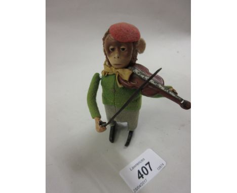 Schuco German tin plate toy clockwork monkey playing a violin