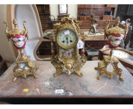19th Century gilded spelter and porcelain mounted three piece clock set, the clock with enamel dial and two train movement