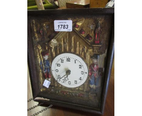 Mid 19th Century German frame clock, the glazed case enlosing a hand embossed metal painted and gilded surround with circular