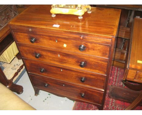 Small late George III mahogany and line inlaid chest with a brushing slide above four graduated drawers with knob handles and
