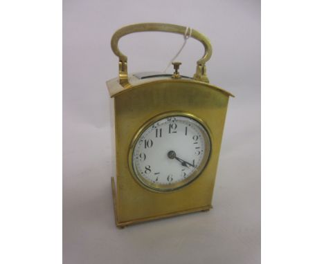 Brass cased carriage clock with dome shaped single glass case, circular enamel dial, Arabic numerals and two train movement w