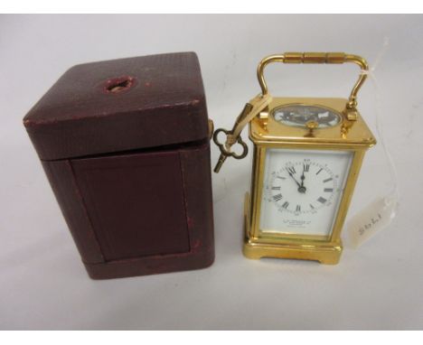 Small early 20th Century French gilt brass repeater carriage clock, the enamel dial with Roman and Arabic numerals, inscribed