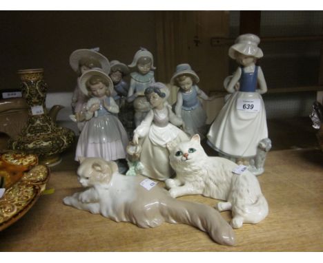 Group of nine various Nao figures of children, a Nao figure of a cat together with a Beswick figure of a cat (a/f)