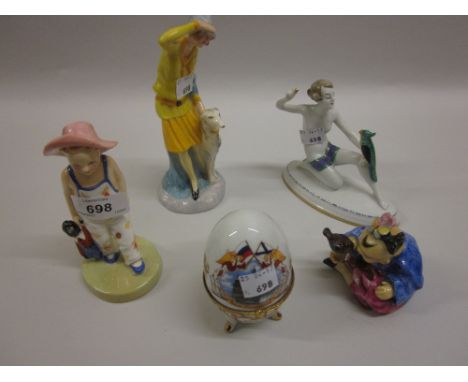 Royal Worcester figure of a child carrying a soft toy, no HN number, together with a Continental porcelain figure of an orien